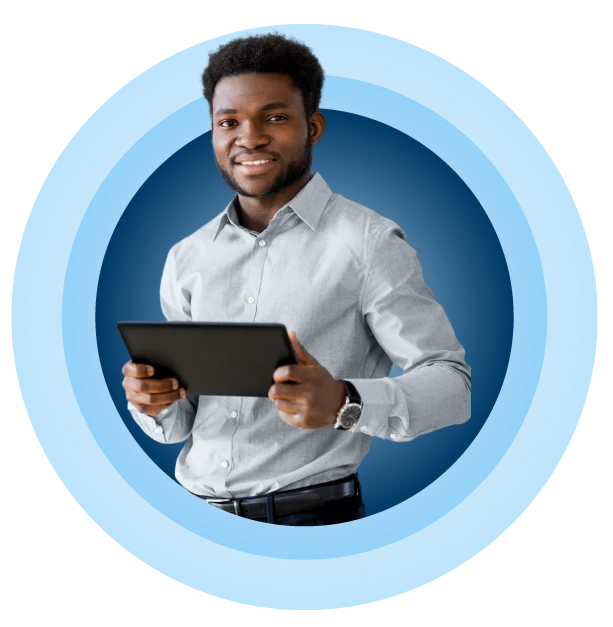 Smiling man in a light blue shirt holding a tablet
