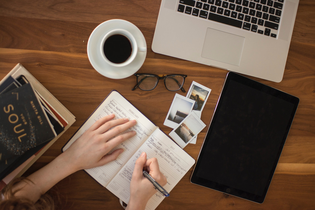 Female writing on notebook
